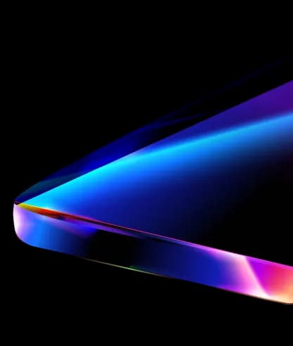Close-up of an iridescent laptop edge symbolising precision product engineering